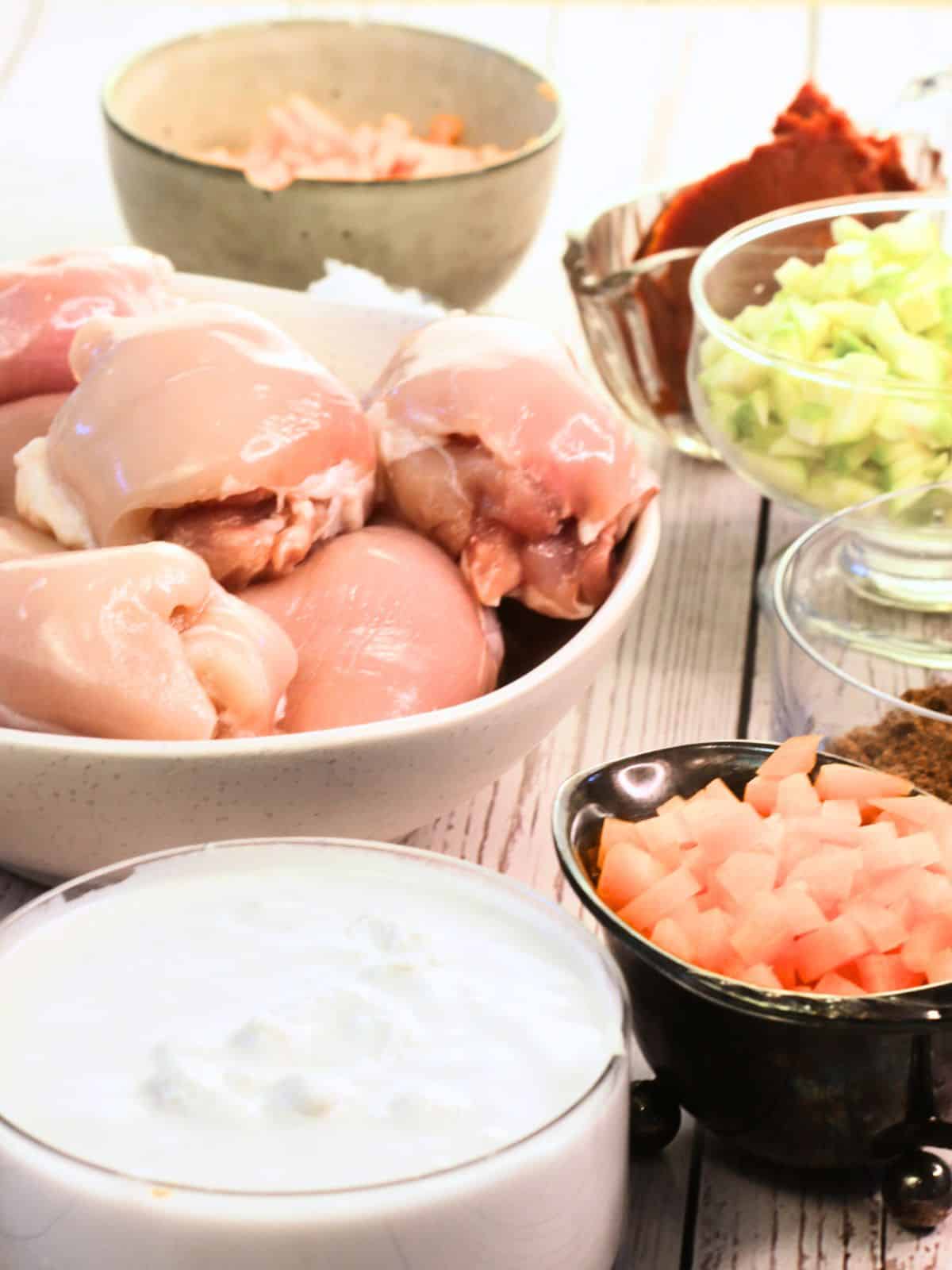 Chicken thighs and chopped vegetables